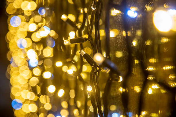 istock yellow wall garland perspective close-up soft focus. Festive blurred backdrop. 1223174939