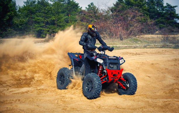 istock Racing in the sand on a four-wheel drive quad. 1223175040