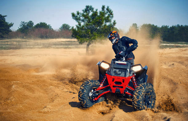 istock Racing in the sand on a four-wheel drive quad. 1223175041
