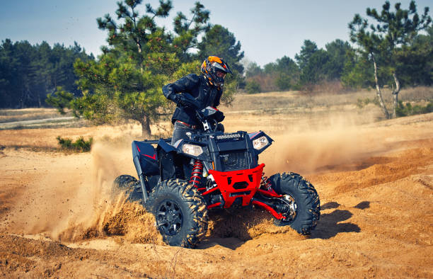 istock Racing in the sand on a four-wheel drive quad. 1223175044