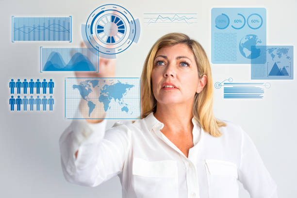 istock Focused woman touching glass board with virtual statistics 1223175968