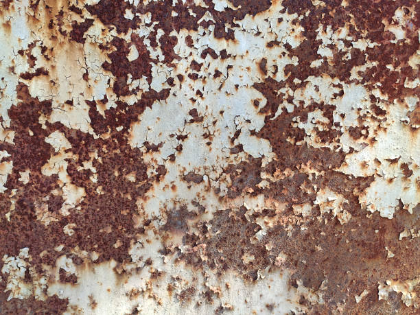 istock Rusty metal panel with cracked paint, corroded grunge metal background 1223178401