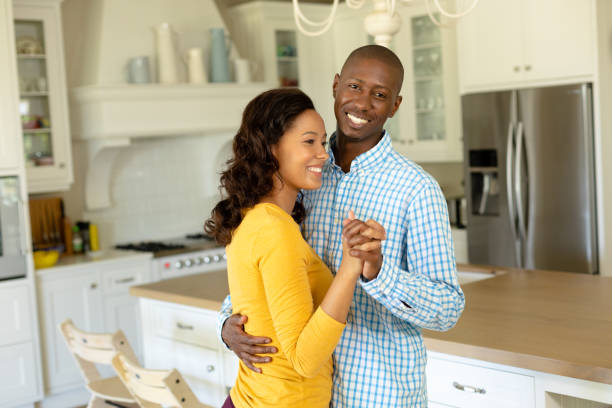 istock Happy couple dancing in their kitchen 1223180347