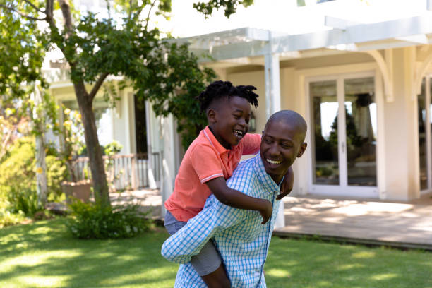 istock Father and son in the garden 1223180634