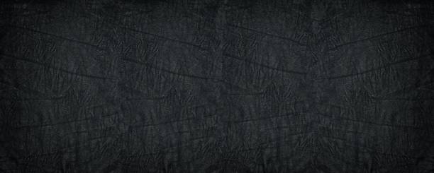 Crumpled black soft leather wide texture. Supple leather textured dark background Crumpled black soft leather wide texture. Supple leather textured dark background wide screen photos stock pictures, royalty-free photos & images