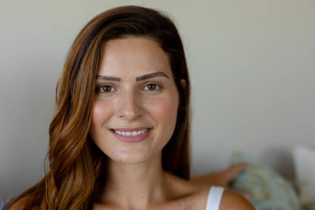 istock Young woman smiling to camera at home 1223181014