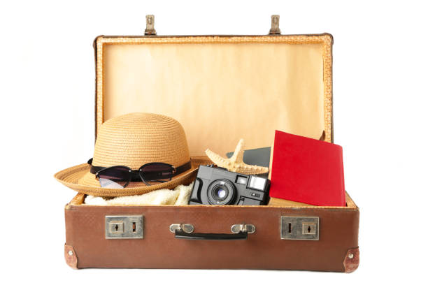 istock Vintage suitcase and beach accessories isolated on white background 1223182621