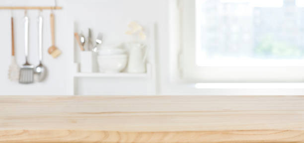 istock Wooden texture board on blurred kitchen window of pastel color 1223182742
