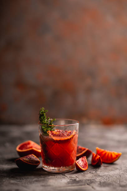 istock Old-fashioned cocktail with blood oranges and thyme on the rustic background 1223185895