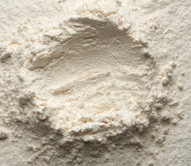 istock white wheat flour scattered, top view, funnel for liquid ingredients 1223189816