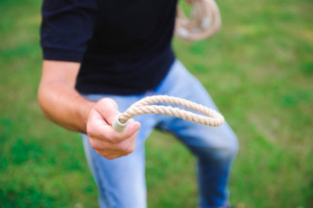 istock Outdoor games - guy playing ring toss in a park. 1223190067