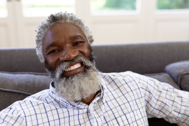 istock Senior mixed race man sitting on a couch 1223190746