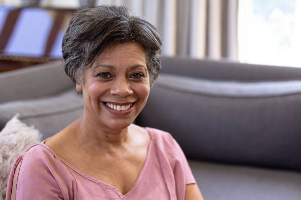 istock Senior mixed race woman sitting on a couch 1223190759