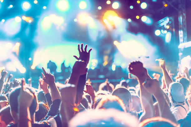 istock cheering crowd at rock concert 1223190919