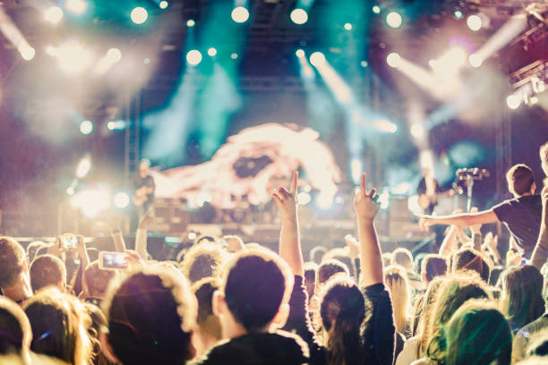 istock cheering crowd at rock concert 1223191695