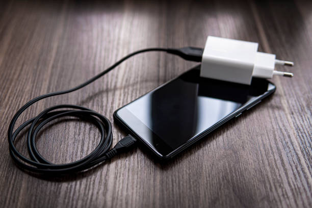istock smartphone and charger with wire 1223194666