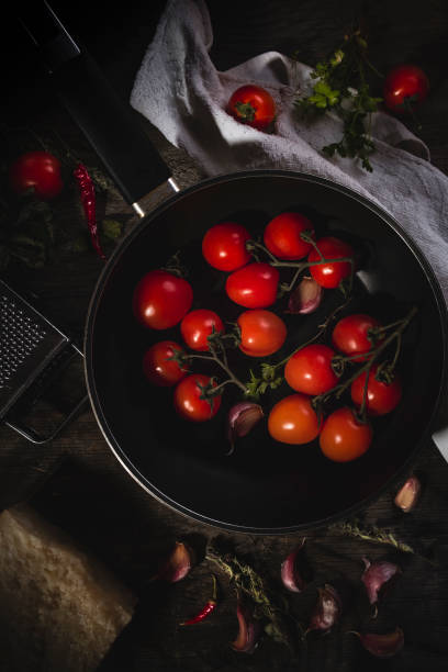 istock Cherry tomatoes freshly picked and thrown into the pan with various spices 1223194733