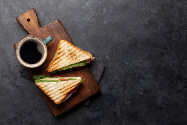 istock Coffee cup and club sandwich 1223195043