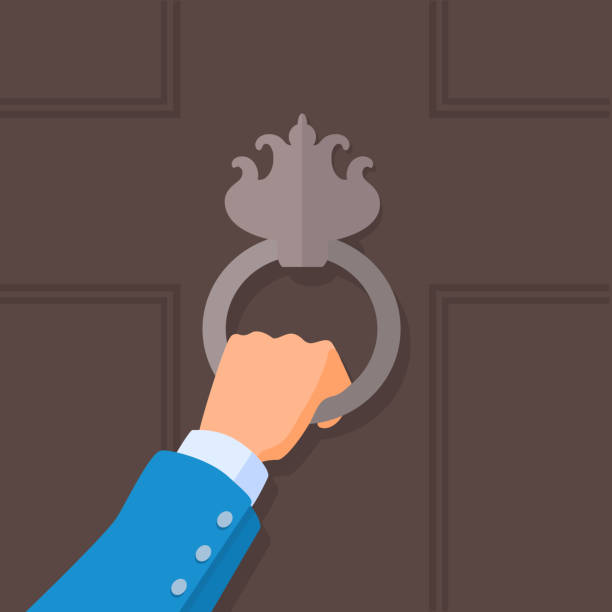 A hand holding a knocker on a door. A vector cartoon illustration. knocking on door stock illustrations