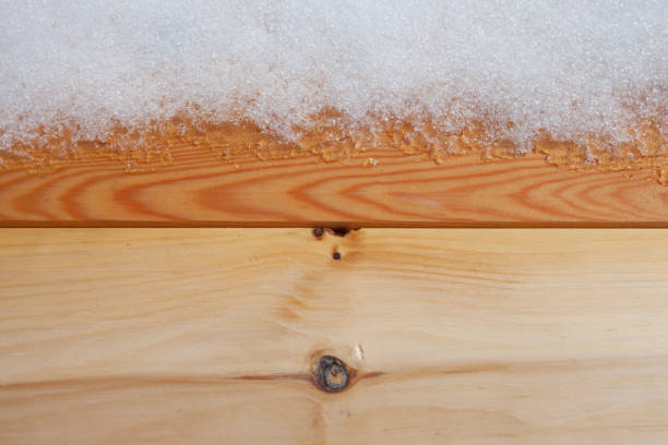 istock natural pine wood panels with fresh snow as background 1223196607