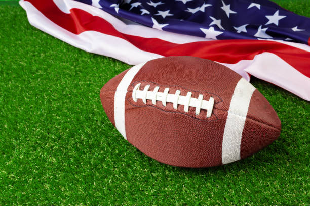 istock American game rugby ball on grass close up 1223198907