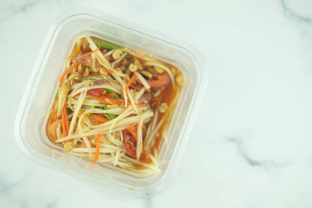 istock Papaya salad in packed plastic box for take away. Top view 1223199053