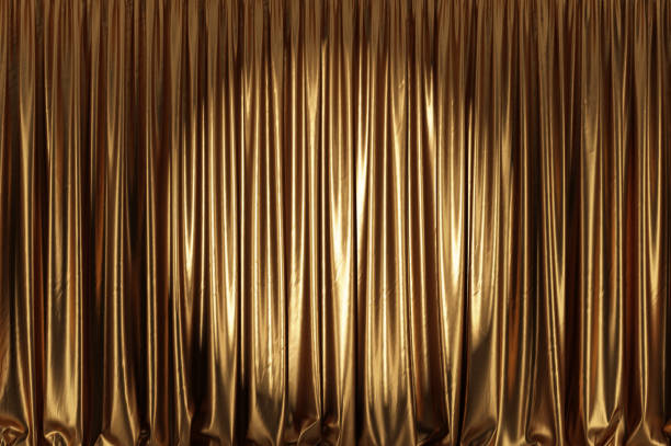 istock Empty theater stage with golden curtains and spotlight. 1223199170