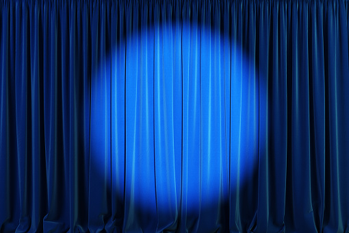 Blue curtains with spotlight or flash.