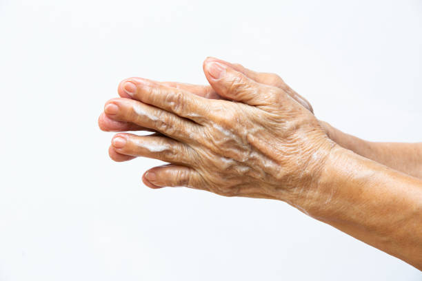 istock Senior woman's hands washing her hands using soap foam in step 1 on white background, Close up & Macro shot, Selective focus, Prevention from covid19, Bacteria, healthcare concept, 7 step wash hand 1223200086