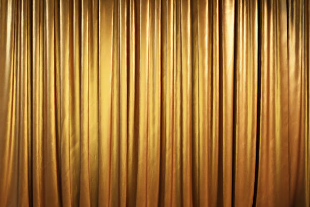 Golden theater curtains or drapes.