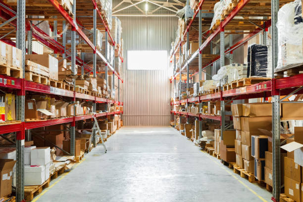 istock Modern warehouse shelves with pile of cardboard boxes 1223202448