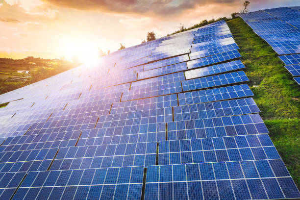 istock Solar panels fields on the green hills 1223205192
