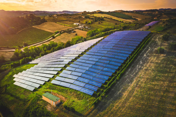 istock Solar panels fields on the green hills 1223205330