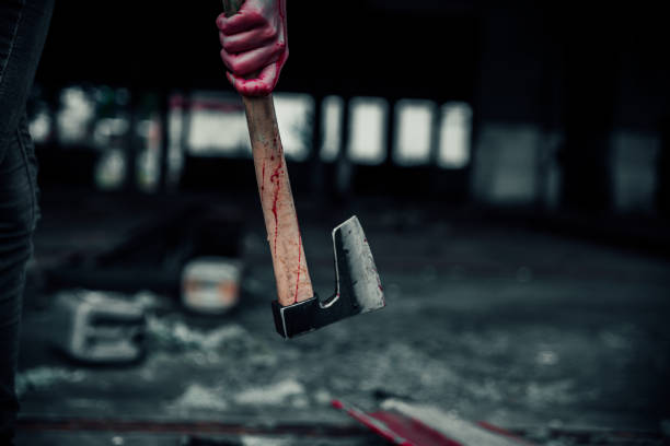 istock Bloody hand holding a bloody axe 1223205420