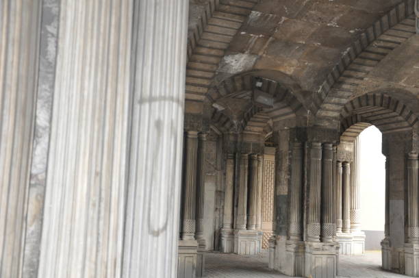 istock Tunnel structure with historical columns, through which the vehicle road passes 1223206707