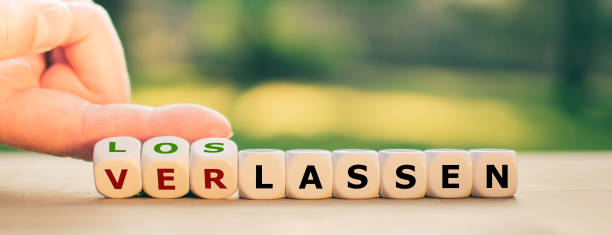 istock Hand turns dice and changes the German word 