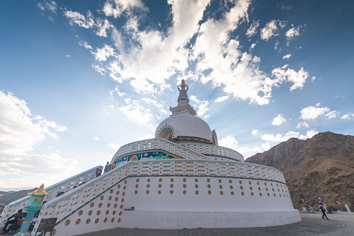 Leh ladakh , India - July 10 2019 ; Shanti Stupa of Ladakh is located on the hilltop at Changspa, at a height of 4,267 metres (13,999 ft), and is located 5 kilometres (3.1 mi) from Leh. The aim behind the construction of the stupa was to commemorate 2500 years of Buddhism and to promote World Peace. His Holiness, the Dalai Lama inaugurated the Shanti Stupa in the year 1985. Leh Ladakh Jammu, Kashmir,Tibet, India