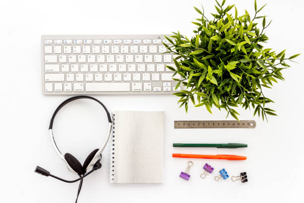 istock E-learning, online course. Computer, book and headphones on white background from above 1223209296