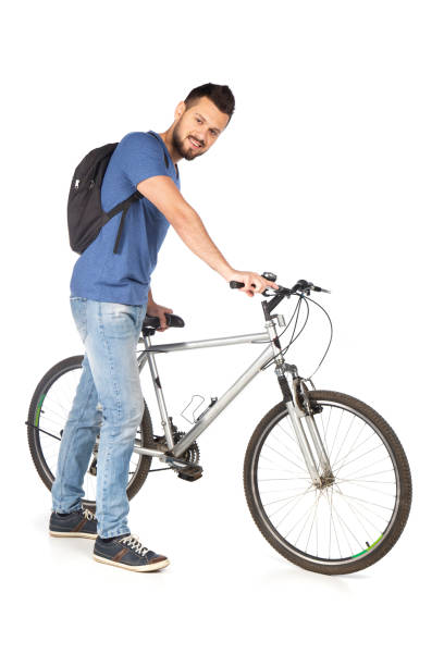 istock Young man with a bicycle talking on a phone 1223212002
