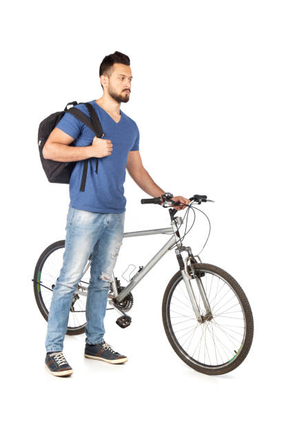 istock Young man with a bicycle talking on a phone 1223212029