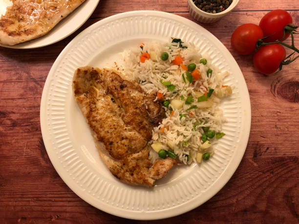 istock Grilled chicken breast with vegetables and rice. 1223214992