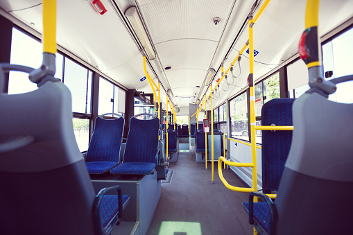 Interior of empty city bus, public transport concept.