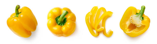 набор свежего цельного и нарезанного сладкого перца - yellow bell pepper стоковые фото и изображения