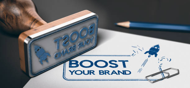 Marketing Services. Brand Boosting. Rubber stamp with the text boost your brand and a rocket symbol printed on a sheet of paper. Concept of marketing. 3D illustration Boosting Brand stock pictures, royalty-free photos & images