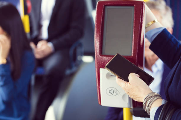 istock Paying by phone in the public bus 1223219341
