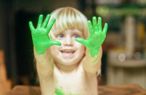istock Young toddler hands are green with finger paint 1223222143