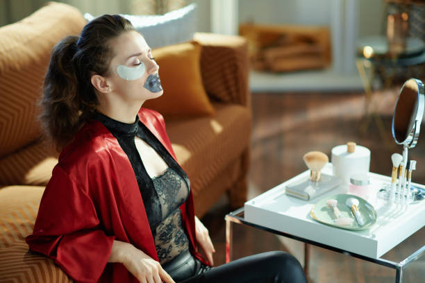 istock relaxed woman using lip mask and eye patches 1223224054