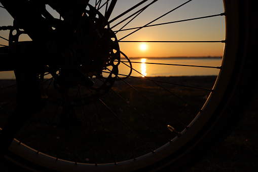 bike rear wheel in sunset large Plöner Lake Prince's Island