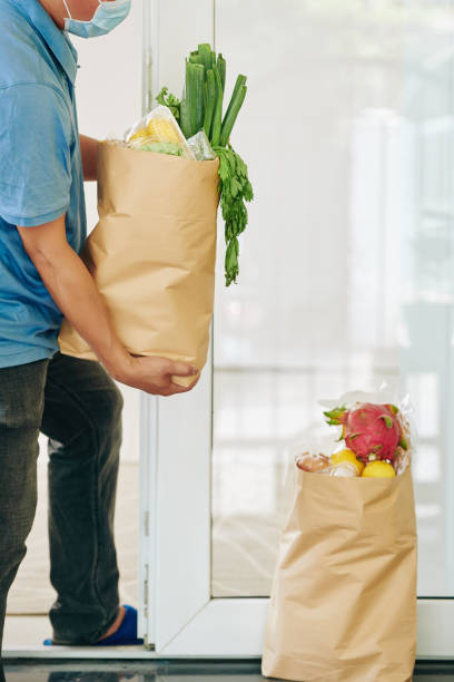 istock Customer taking delivered bags 1223224083