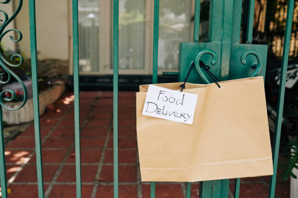 istock Paper bag hanging on gates handle 1223224110